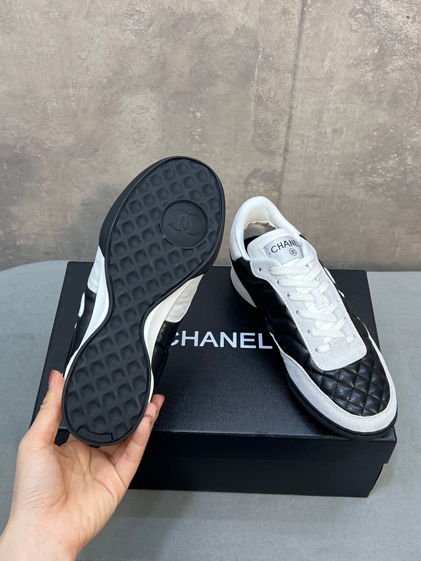 Chanel 26s Sneakers In Black And White Quilted Calfskin CC Logo