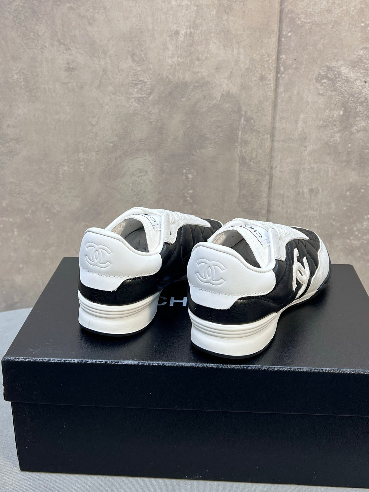Chanel 26s Sneakers In Black And White Quilted Calfskin CC Logo